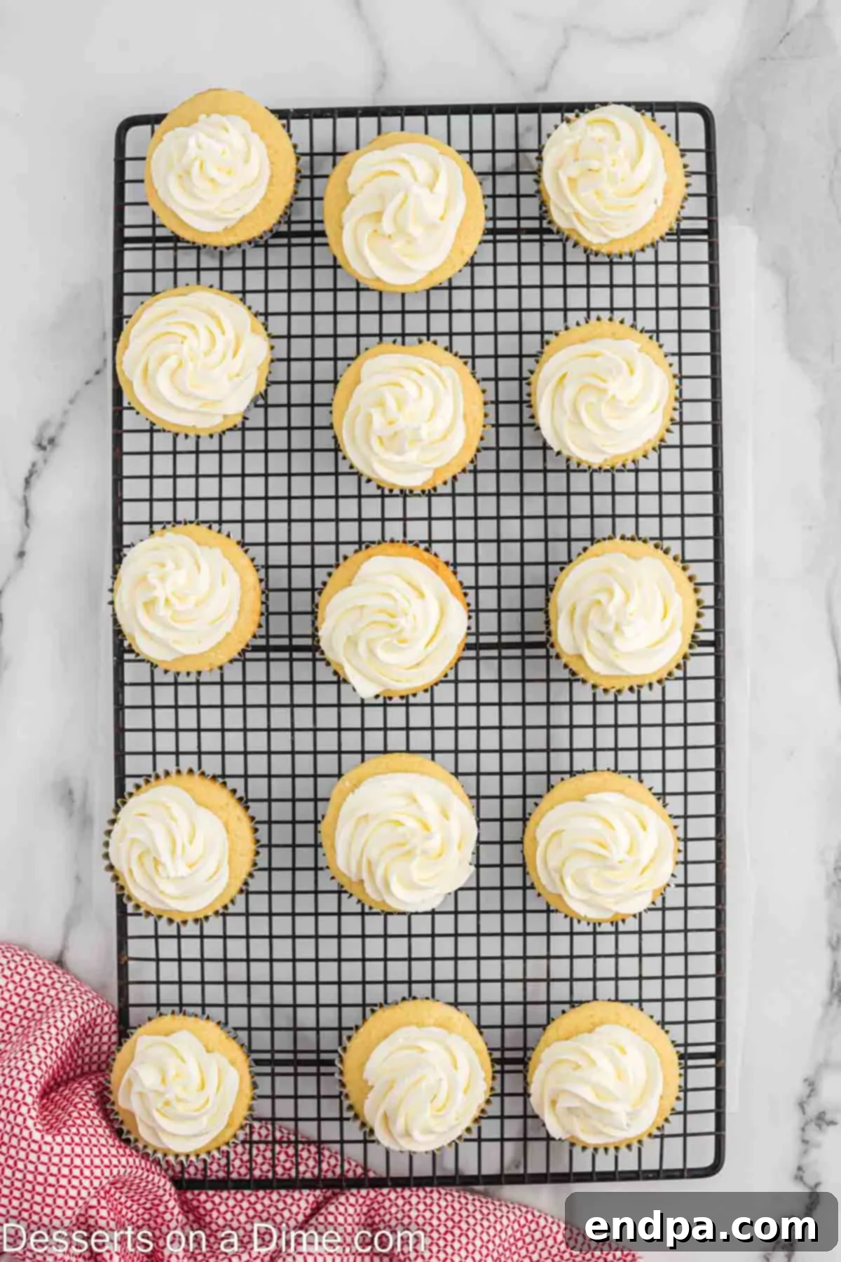 Frosted cupcakes on wire rack. 