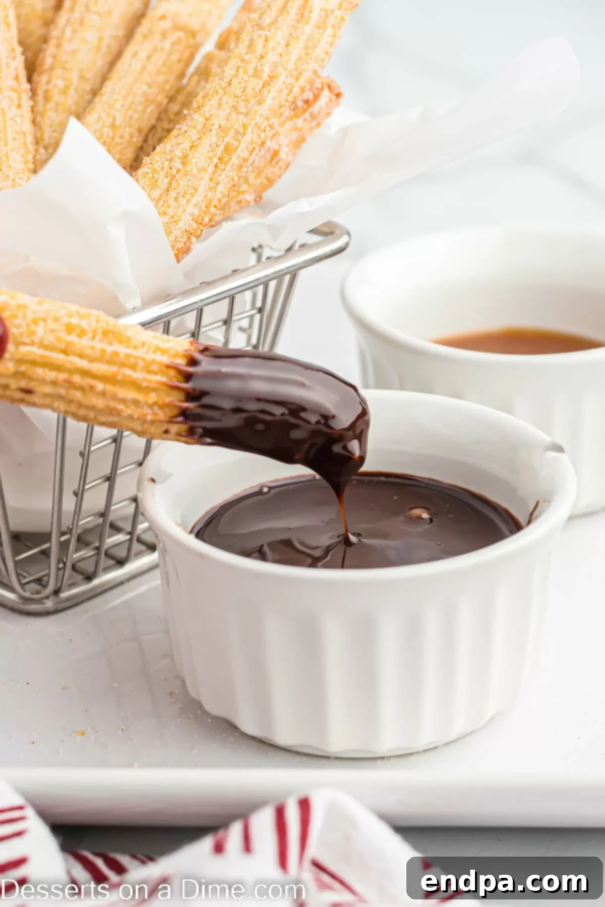 Air fryer churros dipped in chocolate sauce.