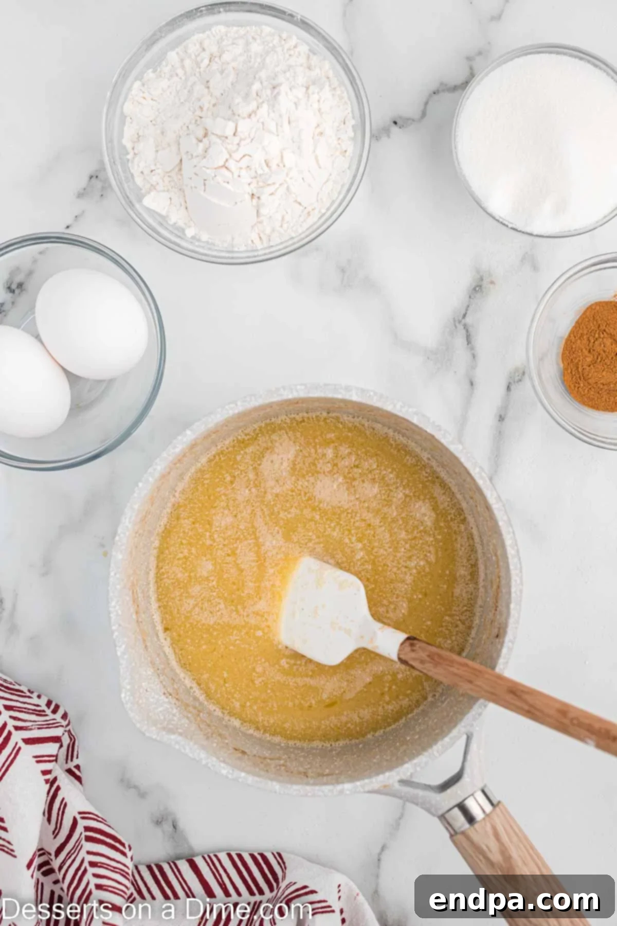 Melted butter, water, and cinnamon combined in a saucepan.