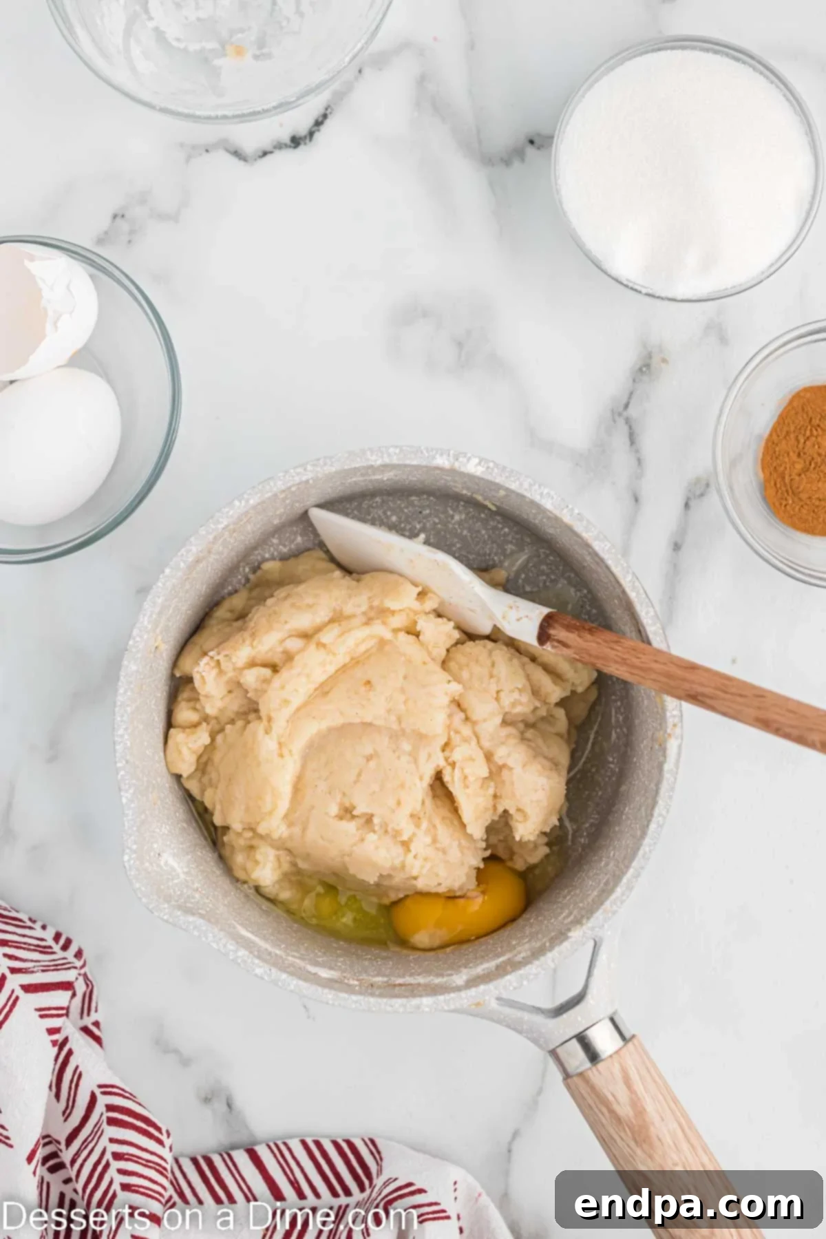 Eggs added to churro dough mixture.