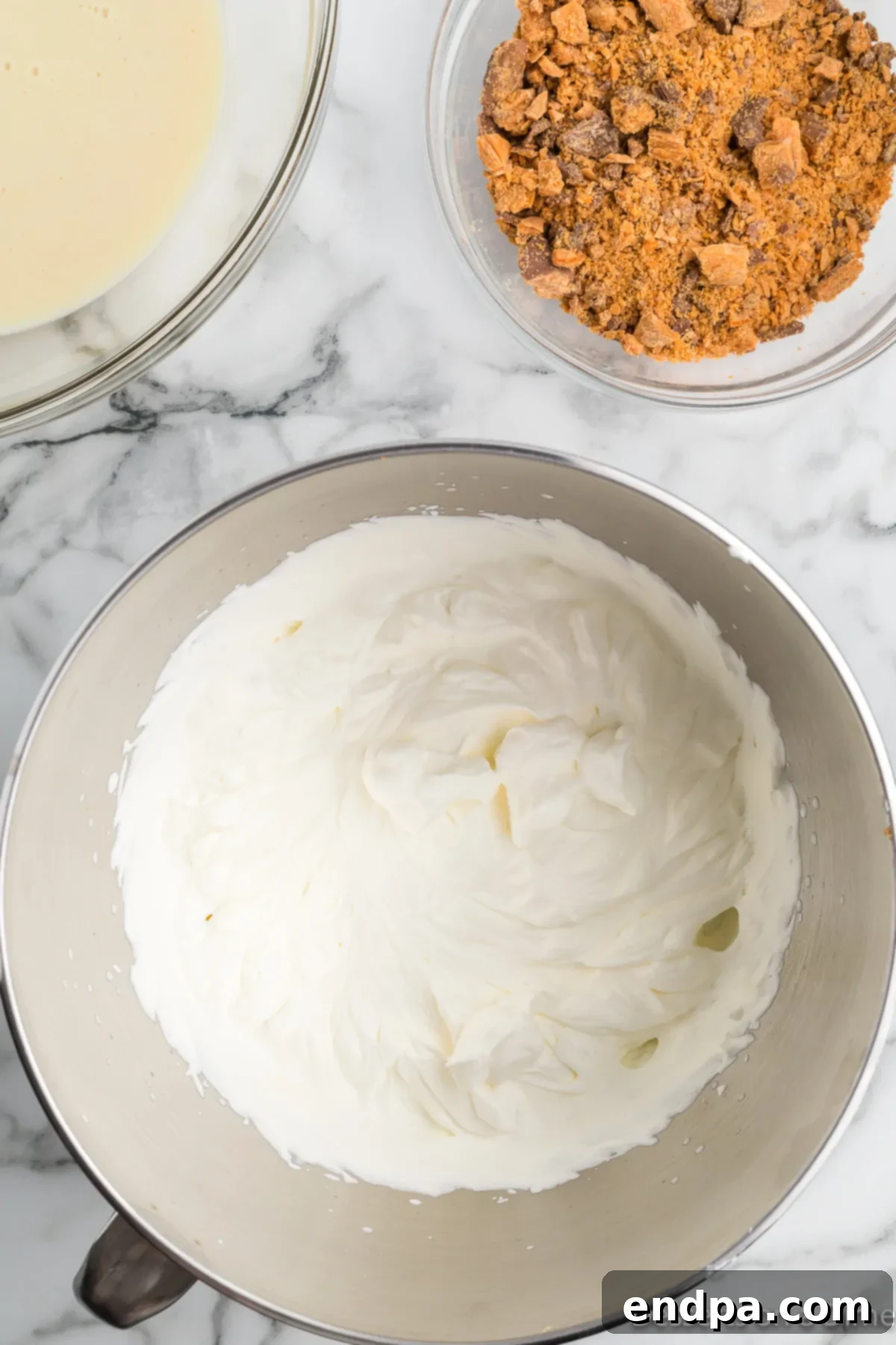 Homemade Butterfinger Crunch Ice Cream 6 Heavy whipping cream in a bowl, before being whipped.