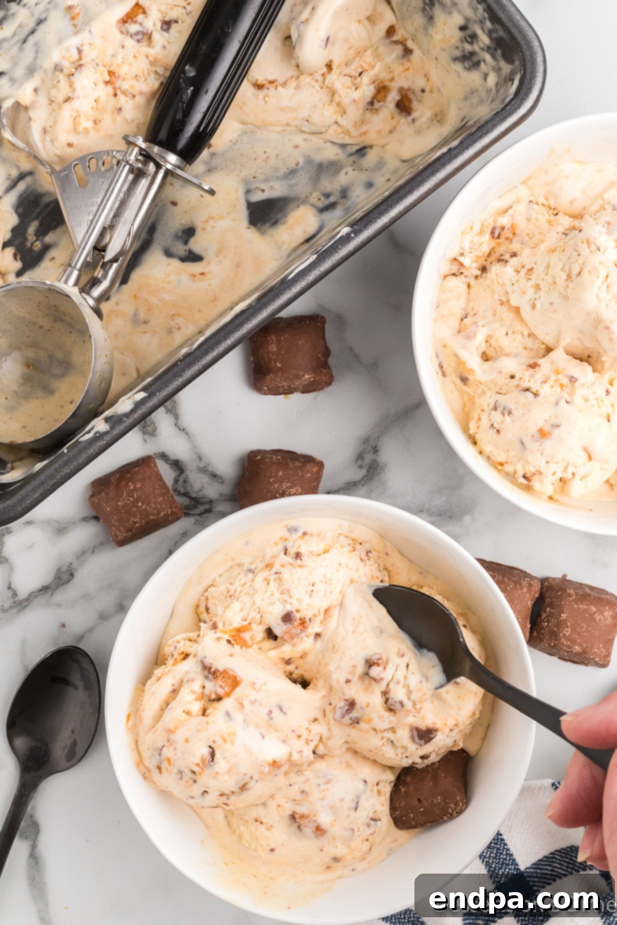 Homemade Butterfinger Crunch Ice Cream 9 Scoops of Butterfinger ice cream served in two bowls, ready to eat.