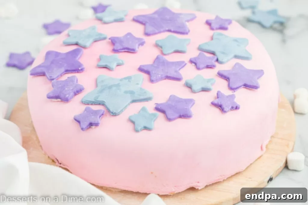 Foolproof Marshmallow Fondant 2 Cake topped with smooth marshmallow fondant adorned with decorative stars, showcasing a professional finish.