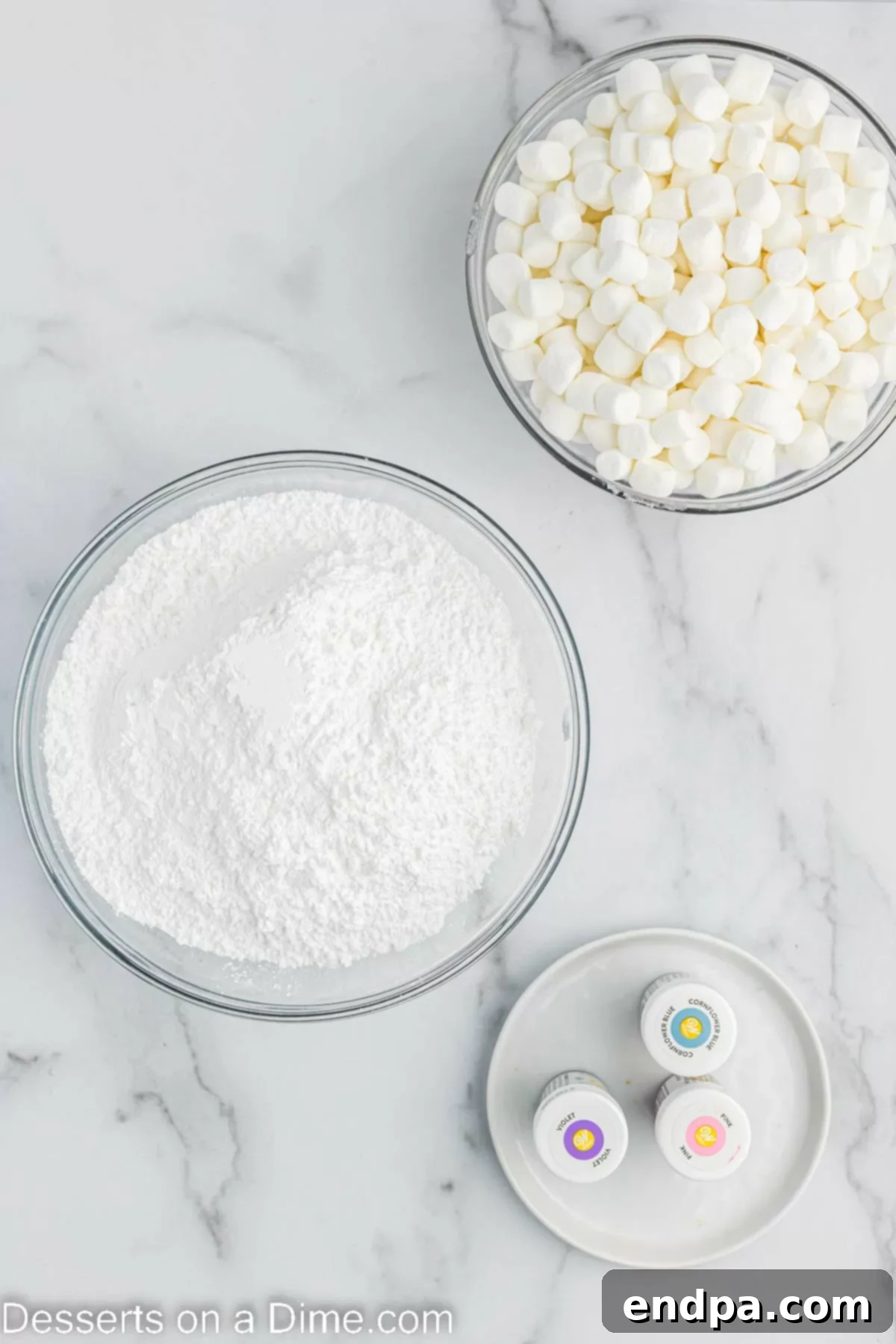 Foolproof Marshmallow Fondant 3 Ingredients for marshmallow fondant: miniature marshmallows, powdered sugar, water, and gel food coloring.