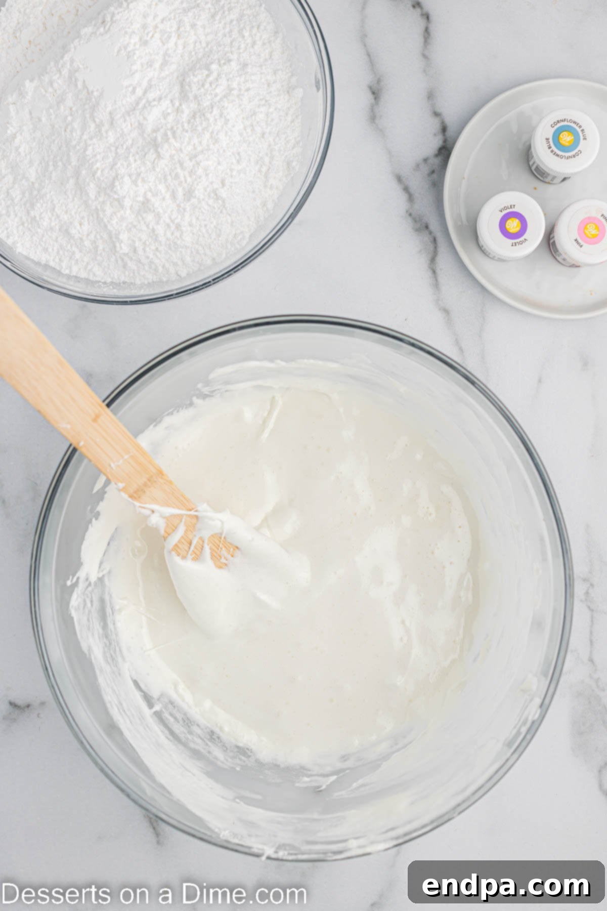 Foolproof Marshmallow Fondant 4 Melted marshmallows in a large microwave-safe bowl, ready for the next step.