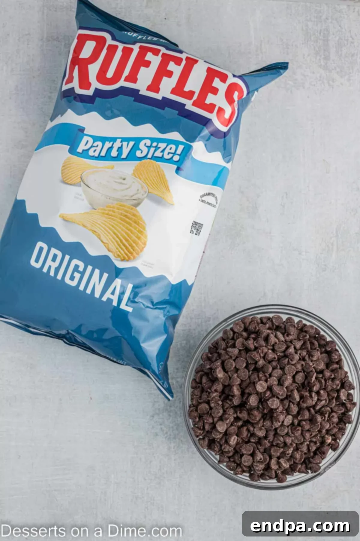The simple yet essential ingredients for Chocolate Dipped Potato Chips: semi-sweet chocolate chips and classic ridged potato chips.