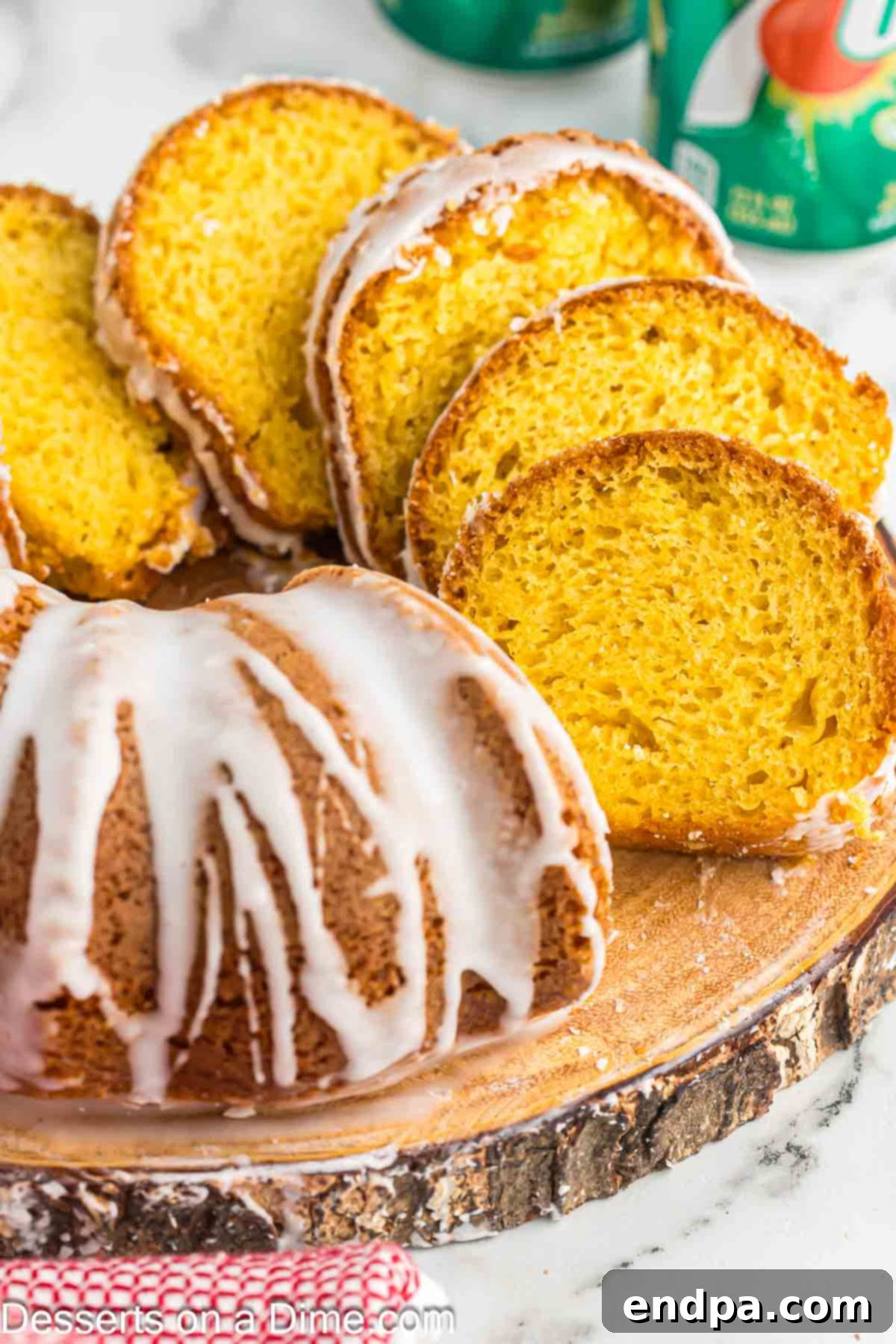 Classic 7 Up Pound Cake 2 Delicious slices of moist 7 Up cake with a luscious lemon glaze drizzled over them, presented beautifully in a bundt cake form.