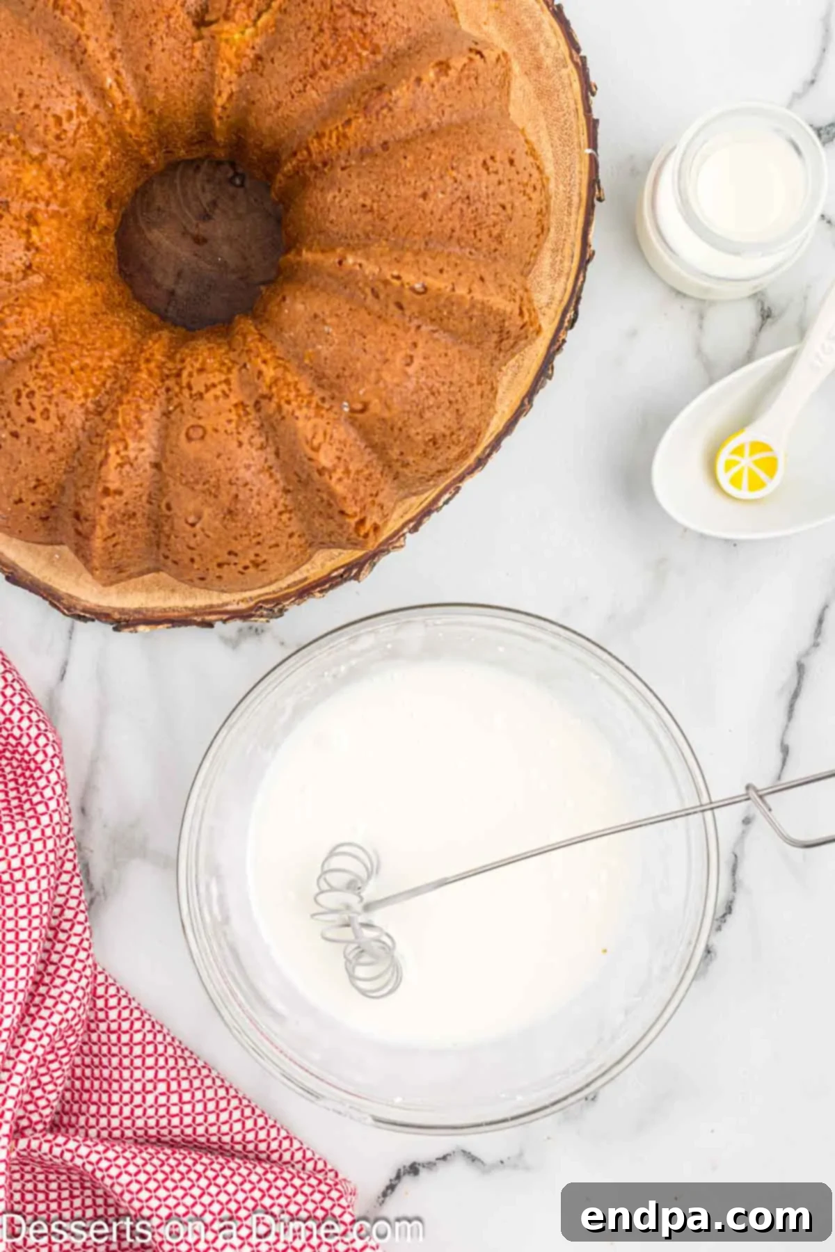Classic 7 Up Pound Cake 8 A small bowl containing a smooth, opaque lemon glaze, ready to be poured over the cooled 7 Up cake.