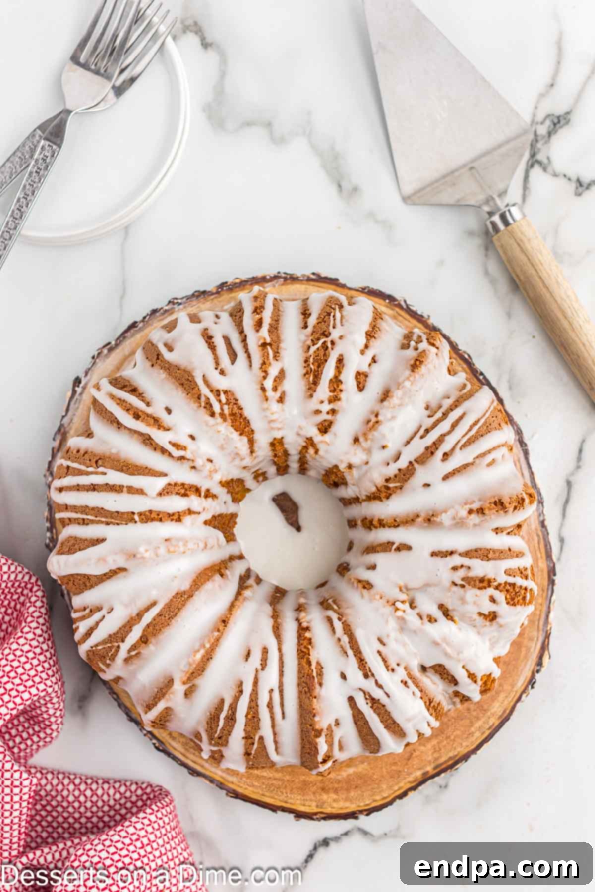 Classic 7 Up Pound Cake 9 A generous amount of lemon glaze being drizzled over the cooled 7 Up cake, elegantly coating its contours.