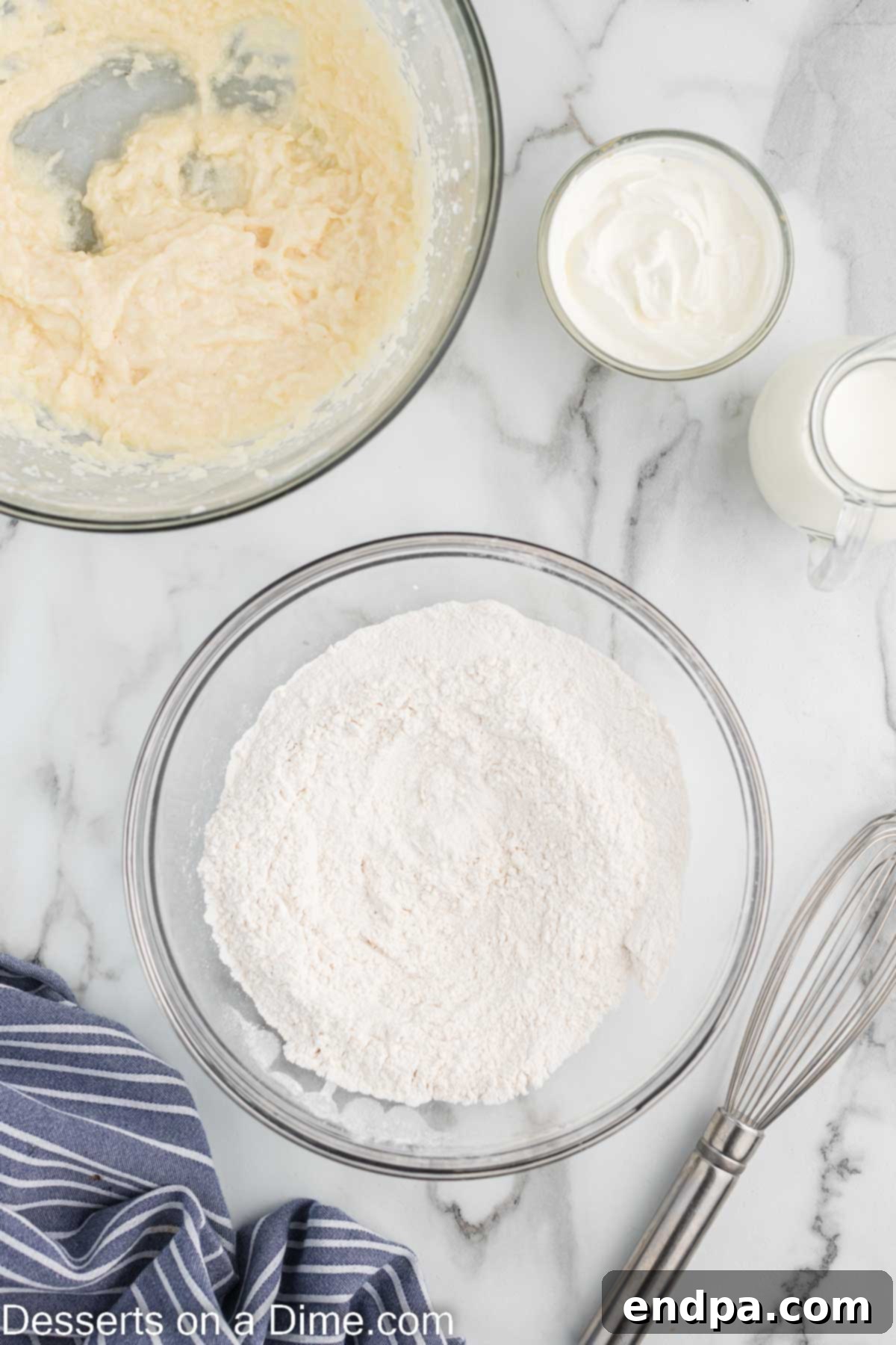 Cookies and Cream Cupcake Heaven 6 A separate mixing bowl containing dry ingredients: flour, baking powder, baking soda, and salt.