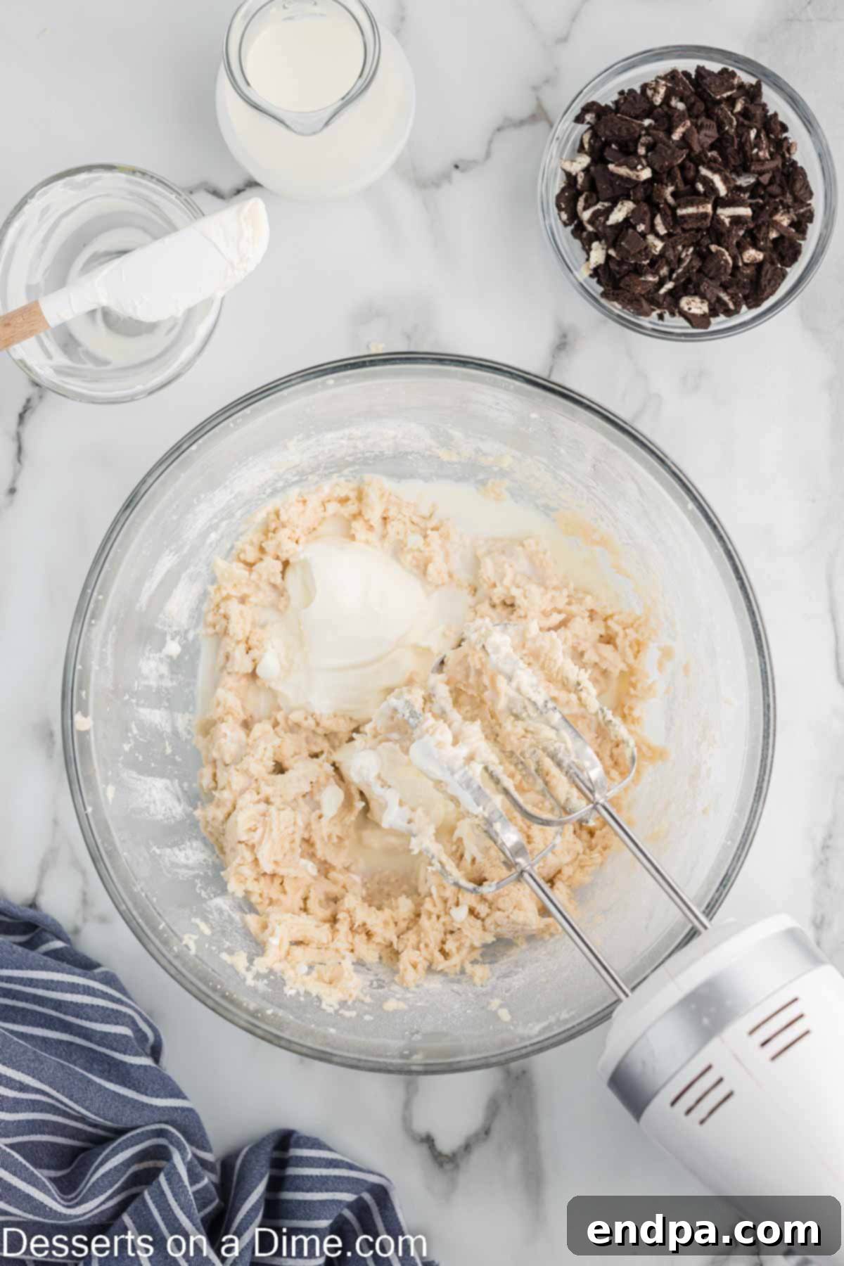 Cookies and Cream Cupcake Heaven 8 Sour cream and whole milk being added to the cupcake batter.