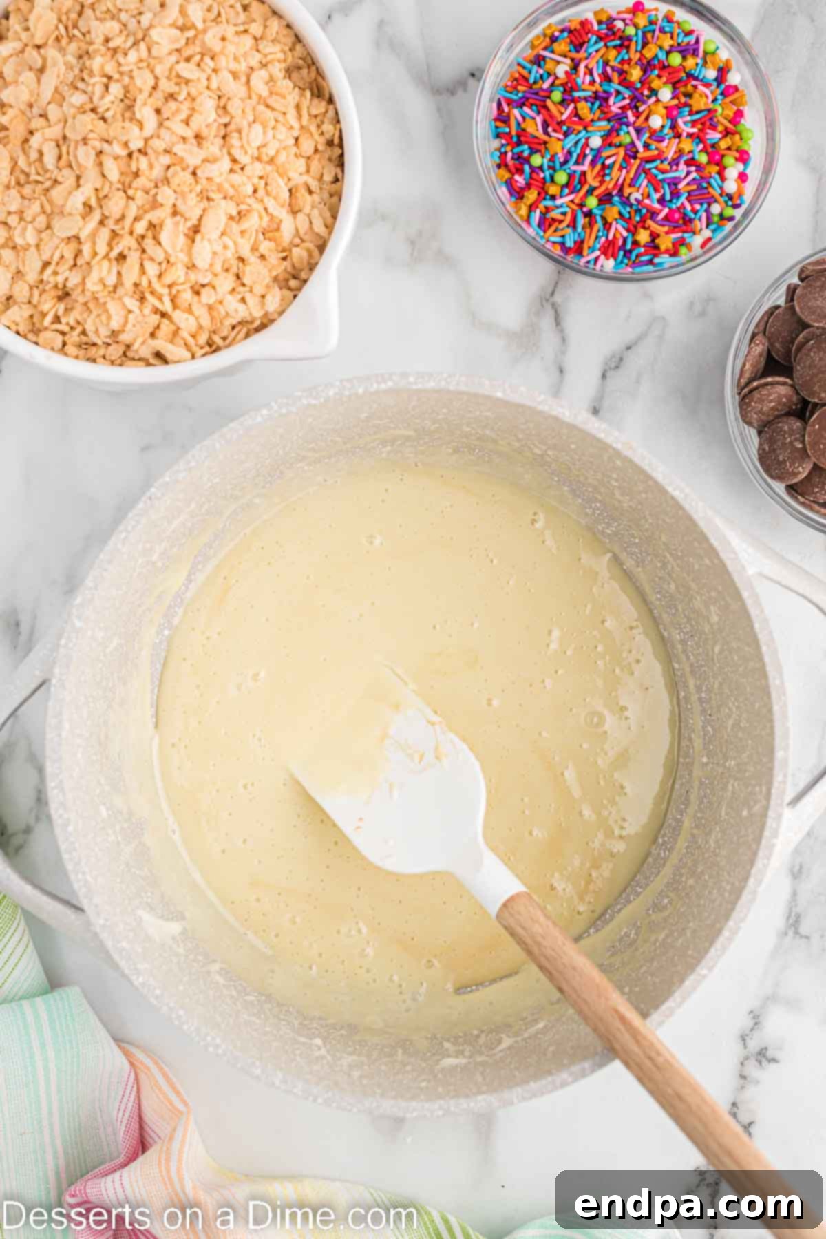 Melted butter and marshmallows combined in a bowl.