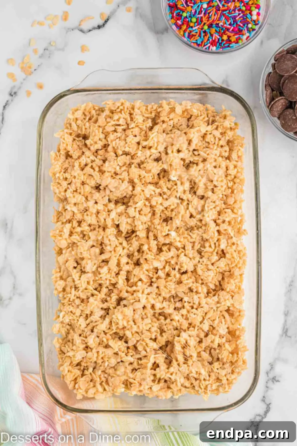 Cereal mixture pressed into baking dish.