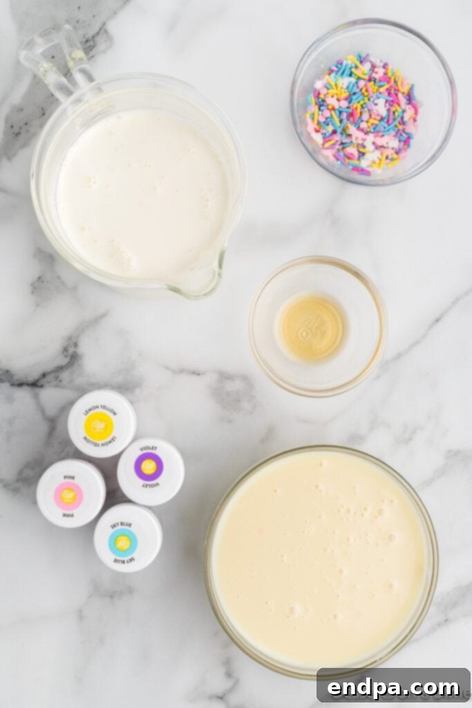 Rainbow Unicorn Dream 3 Ingredients needed: heavy whipping cream, sweetened condensed milk, vanilla extract, food coloring, and unicorn sprinkles, neatly arranged for the recipe.