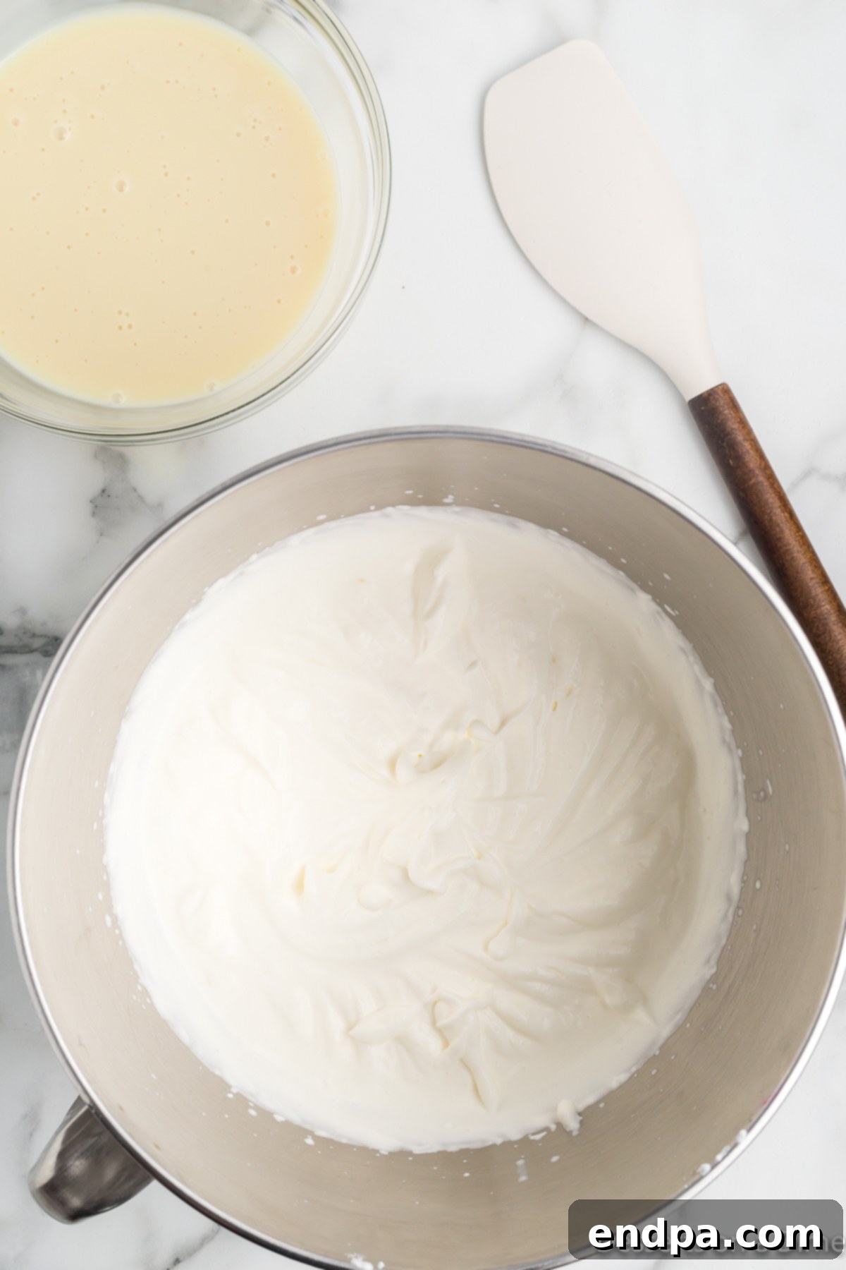 Rainbow Unicorn Dream 4 Mixing bowl with heavy whipping cream being beaten to stiff peaks.