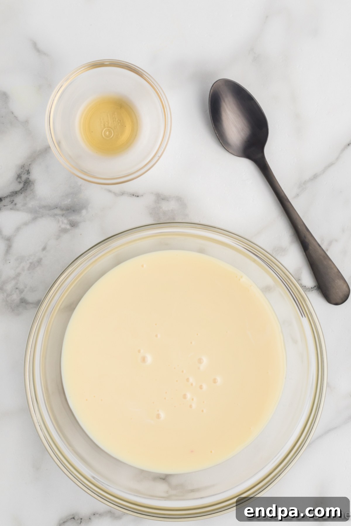 Rainbow Unicorn Dream 5 Separate bowl with sweetened condensed milk and vanilla extract stirred together.