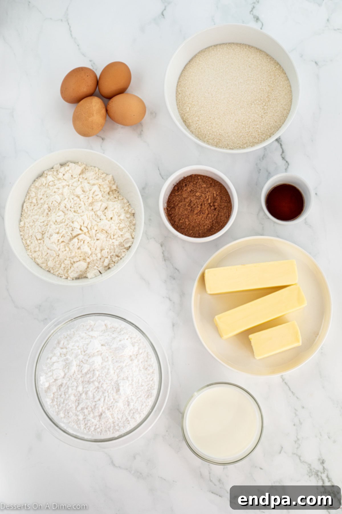 Ingredients for brownies - cocoa powder, flour, vanilla, butter, milk, powdered sugar.