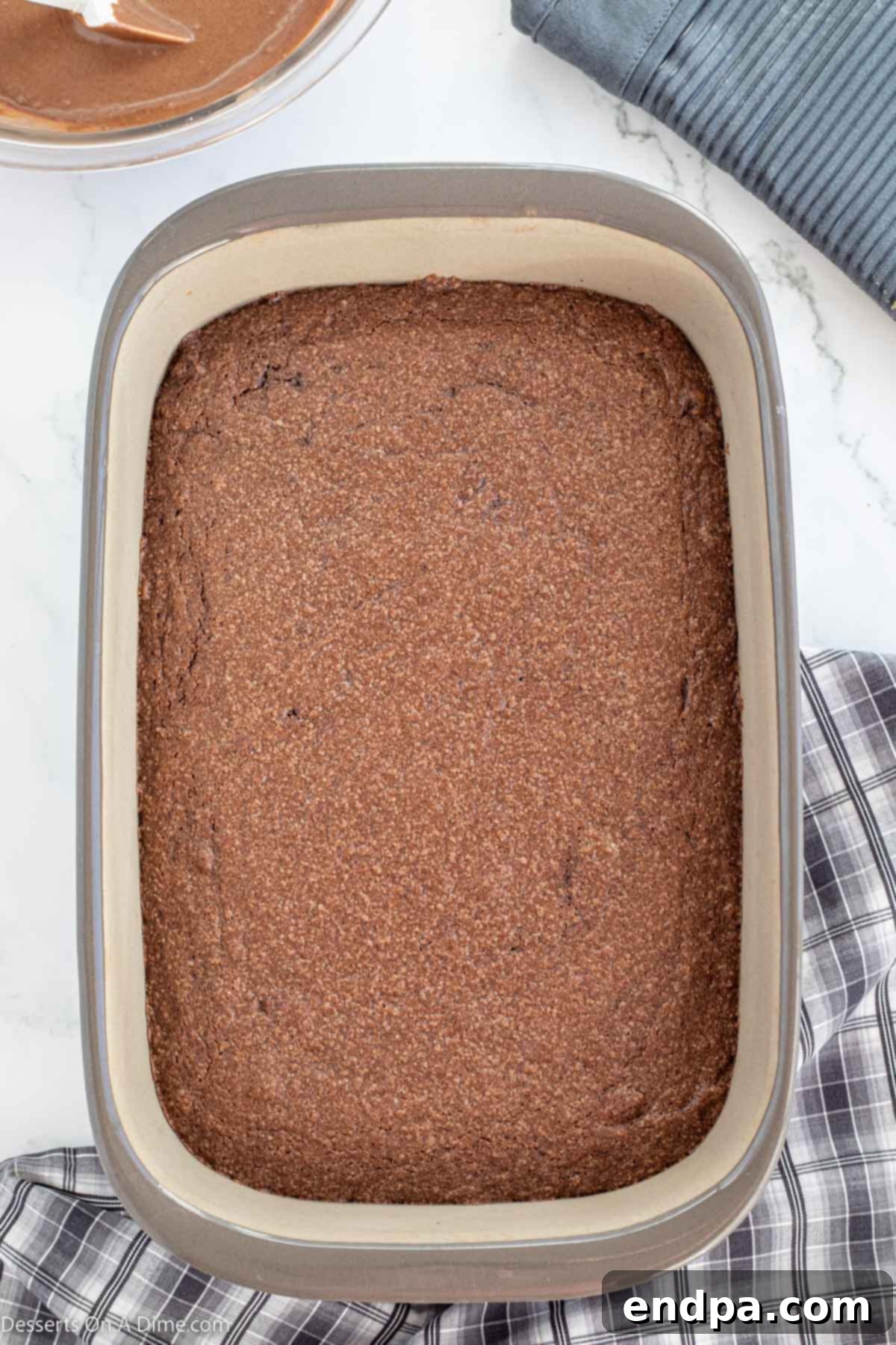Cake baked and cooling in pan. 