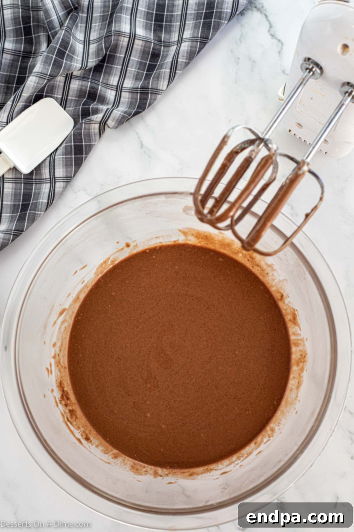 Frosting ingredients combined until smooth in mixing bowl. 