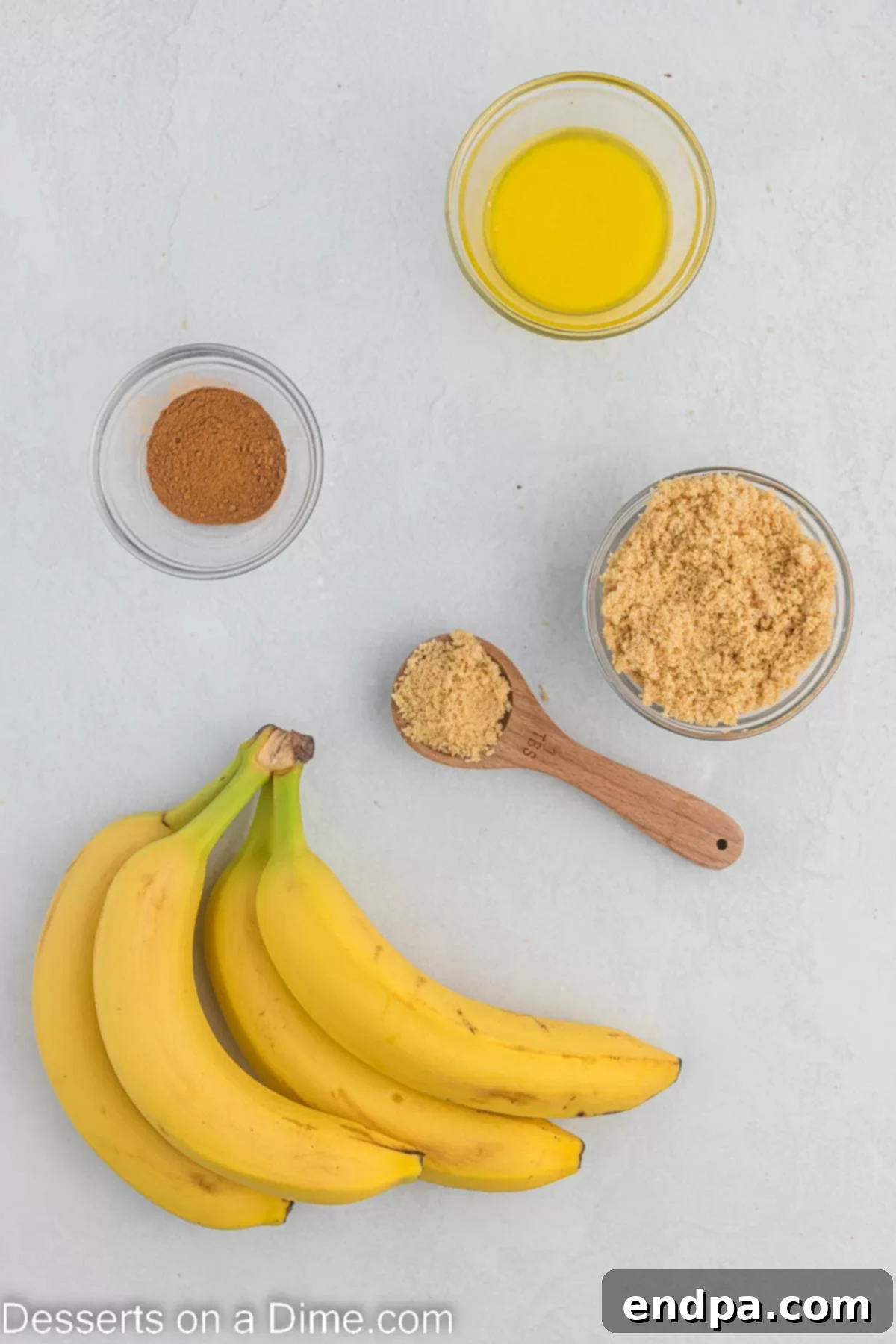 Ingredients for air fryer bananas including whole bananas, brown sugar, melted butter, and ground cinnamon.