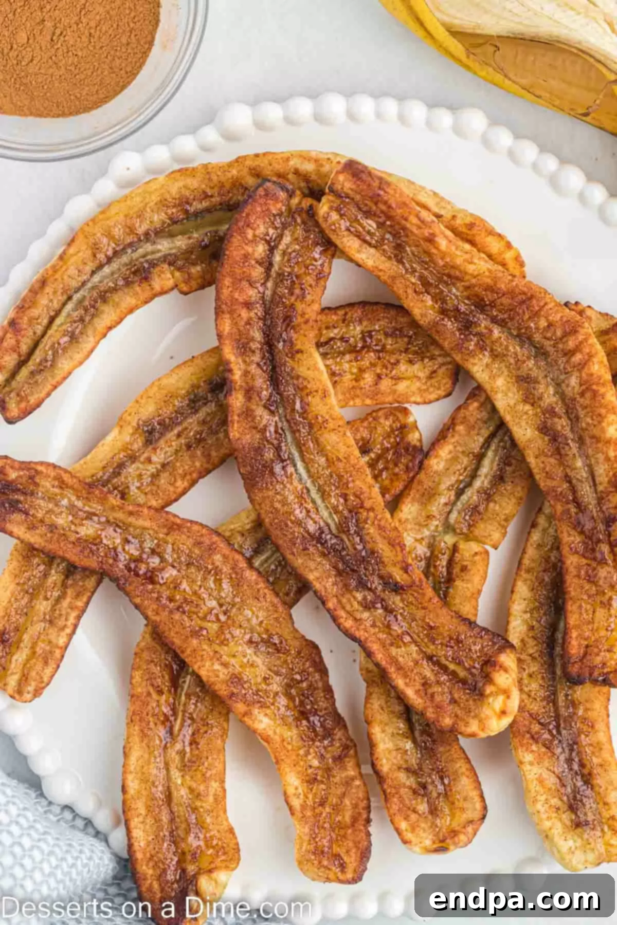 Freshly air-fried banana slices served on a platter.