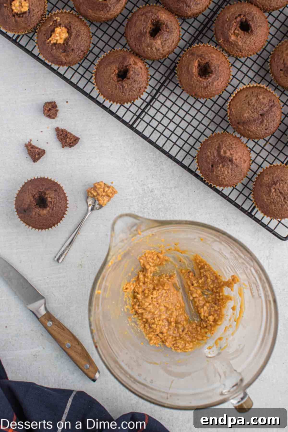 Chopped peanuts being added to the melted caramel mixture.