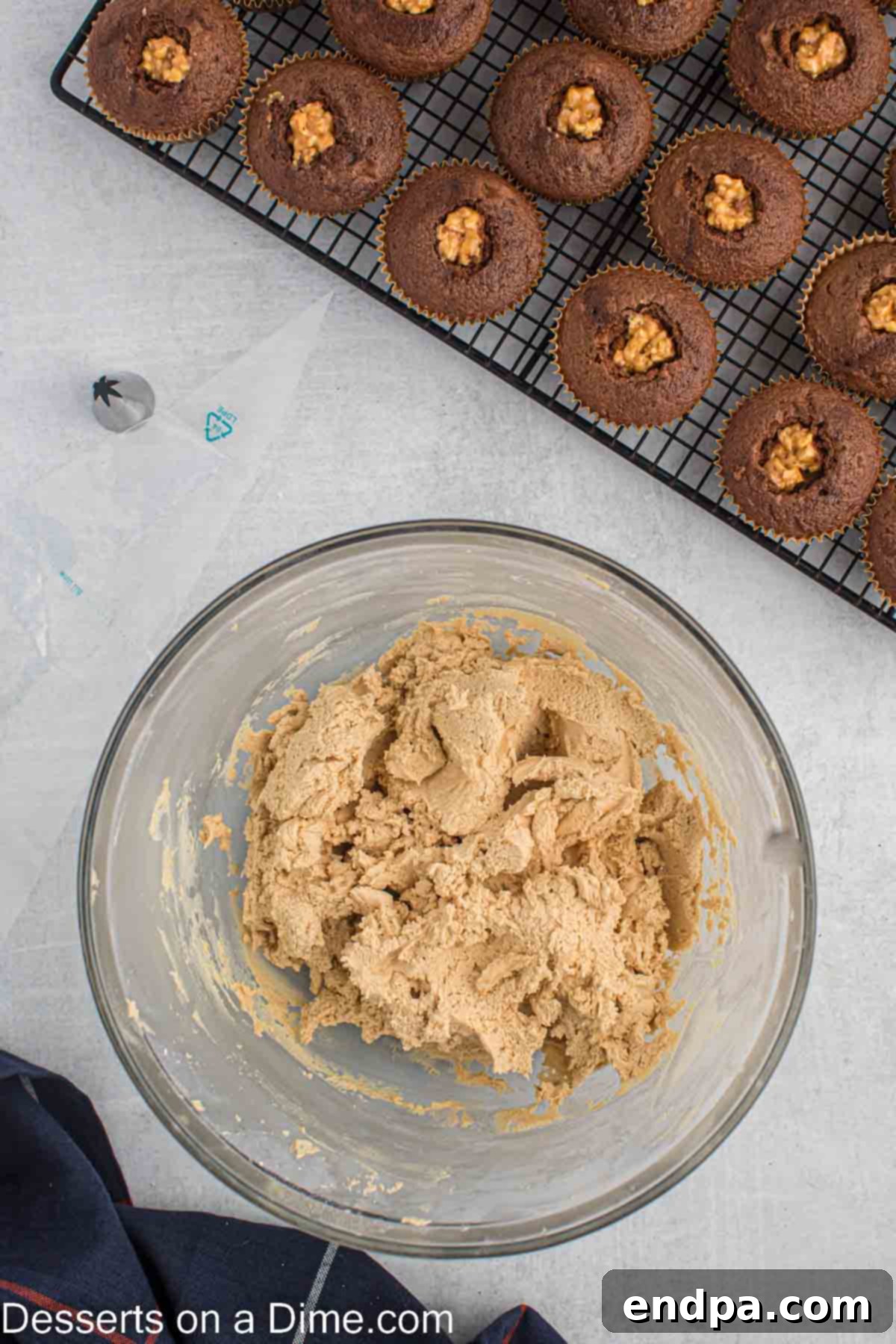 Powdered sugar being slowly added to the creamed butter and peanut butter mixture.