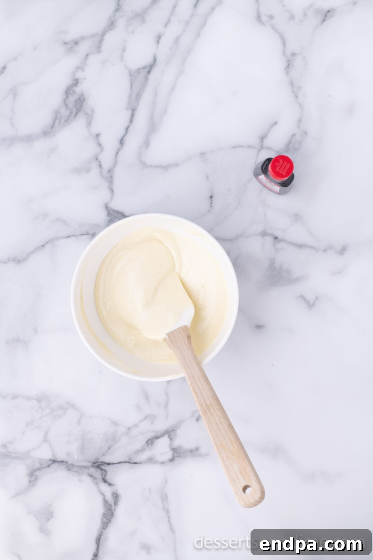 Easy Holiday Peppermint Bark 5 Finely chopped white chocolate in a microwave-safe bowl, prepared for melting.