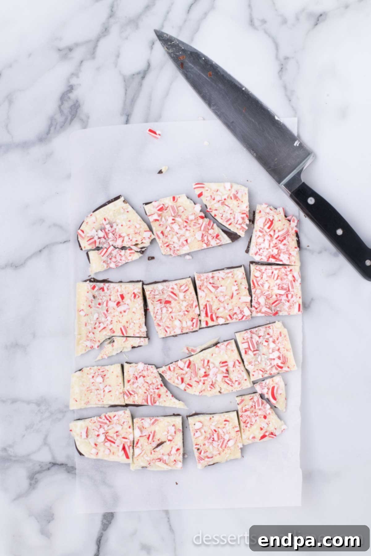 Easy Holiday Peppermint Bark 7 Finished peppermint bark with the white chocolate layer spread over the dark, topped with generous candy cane sprinkles.