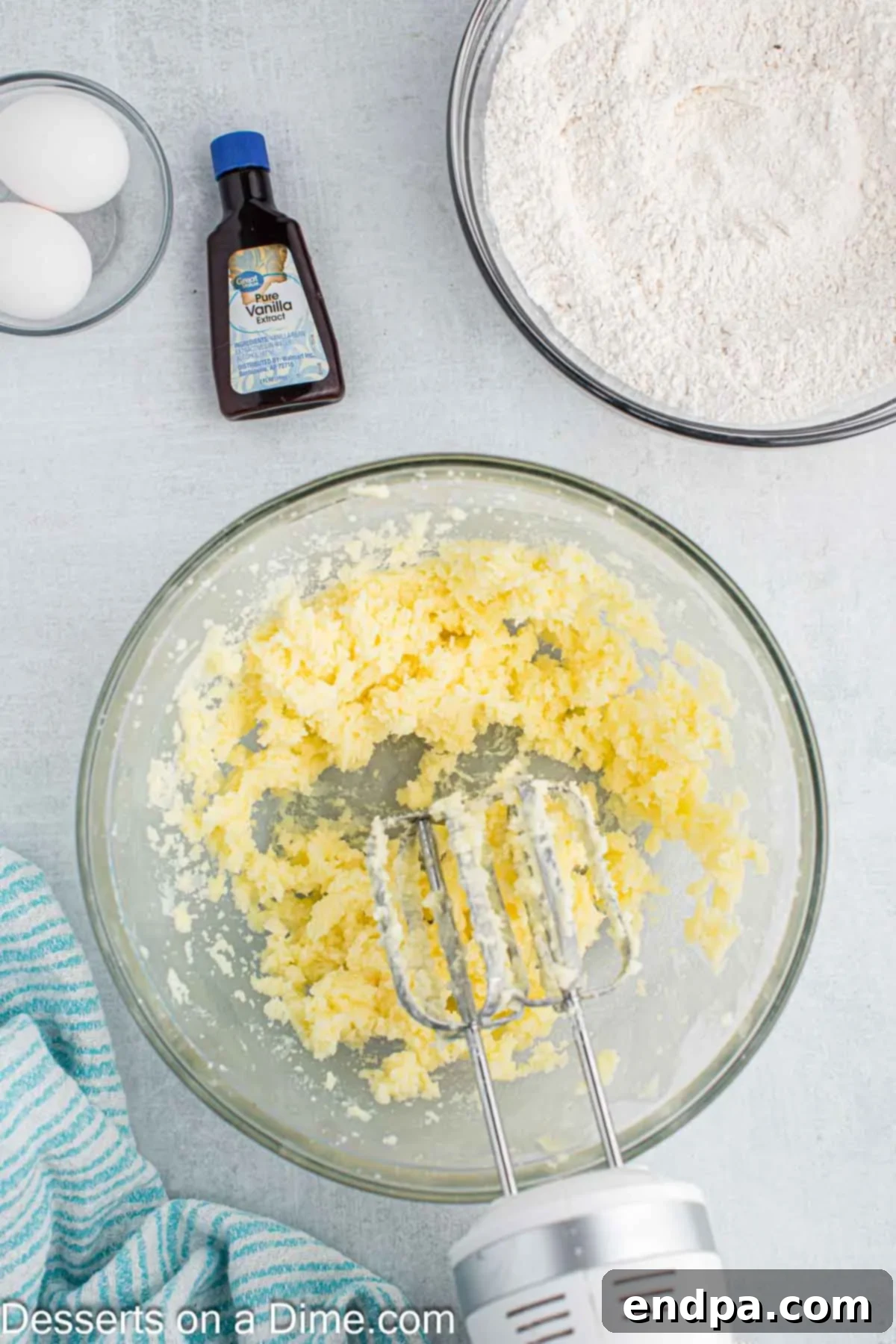 Enchanted Unicorn Treats 5 A stand mixer creaming softened butter with granulated sugar until light and fluffy.