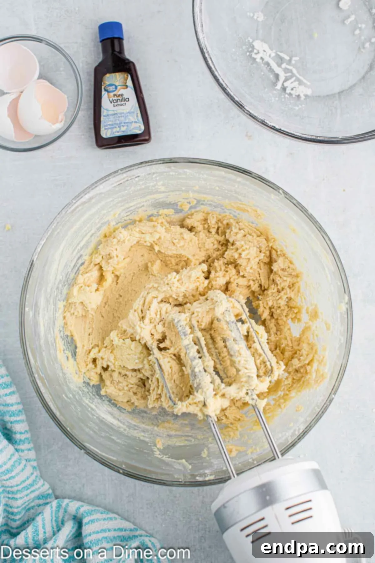 Enchanted Unicorn Treats 8 The dry flour mixture being slowly added to the wet ingredients, combining to form cookie dough.