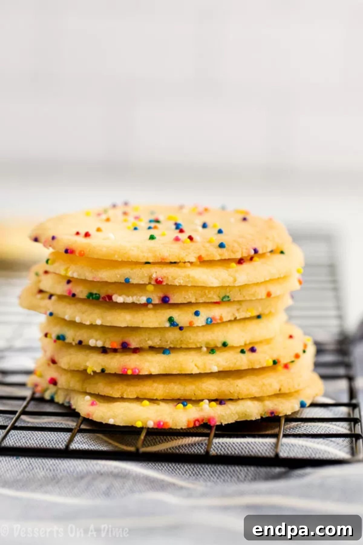 3 ingredient sugar cookies are so easy to make that you can make this 3 ingredient sugar cookies recipe anytime. Try 3 ingredient sugar cookies with no egg. Everyone will love this 3 ingredient sugar cookies recipe. 3 ingredient sugar cookies simple and easy. Even the kids can help make these 3 ingredient sugar cookies easy and simple. #dessertsonadime #3ingredientsugarcookies Stack of 3 Ingredient sugar cookies.