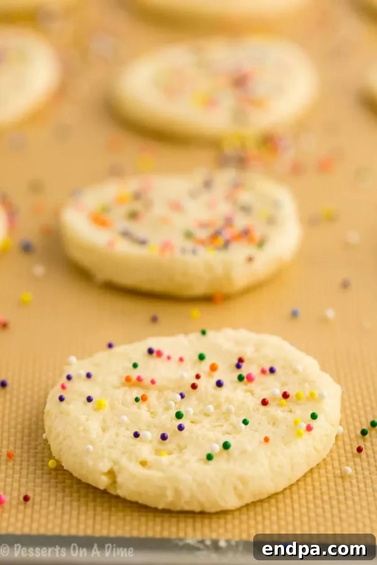 3 ingredient sugar cookies are so easy to make that you can make this 3 ingredient sugar cookies recipe anytime. Try 3 ingredient sugar cookies with no egg. Everyone will love this 3 ingredient sugar cookies recipe. 3 ingredient sugar cookies simple and easy. Even the kids can help make these 3 ingredient sugar cookies easy and simple. #dessertsonadime #3ingredientsugarcookies Sugar Cookies arranged together.