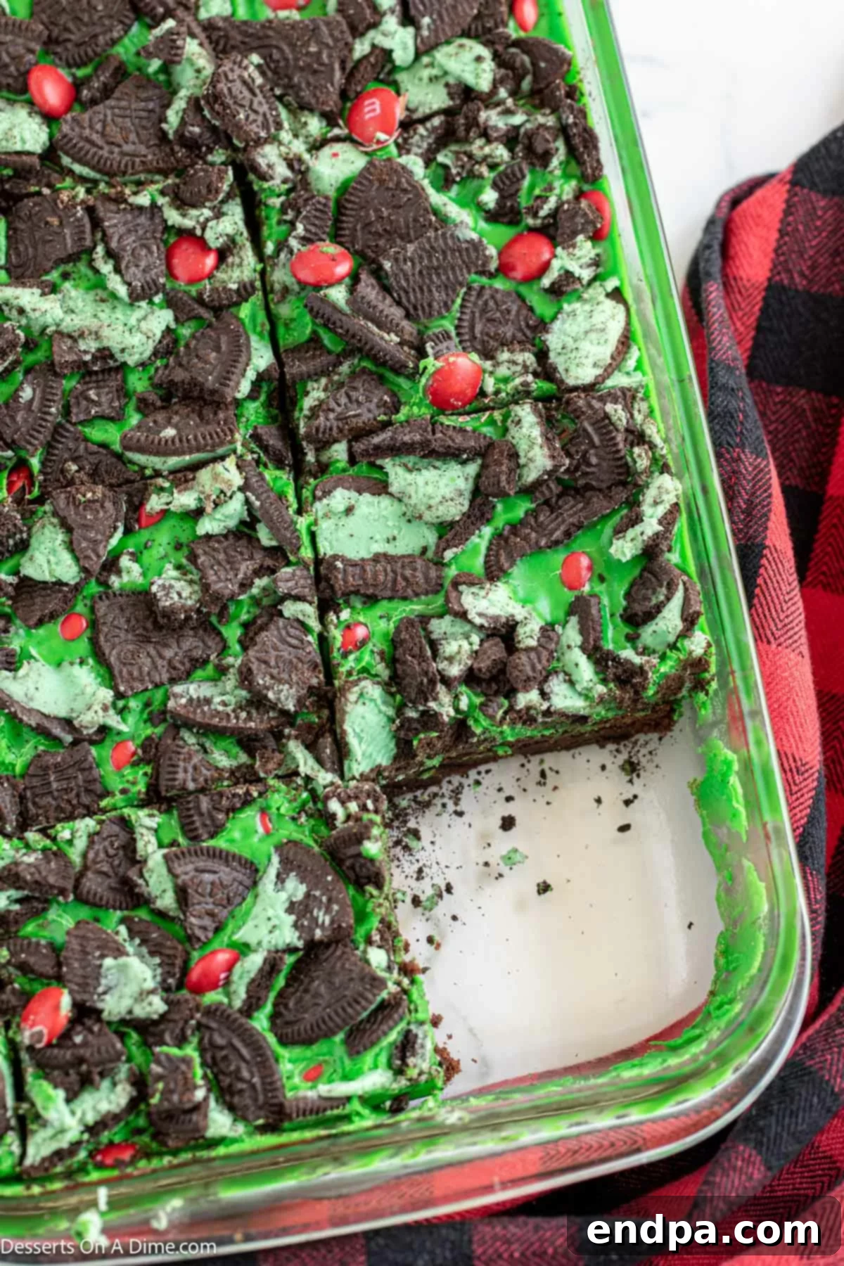 Grinch Green Brownies 11 Grinch brownies perfectly cut into square bars and arranged for serving.