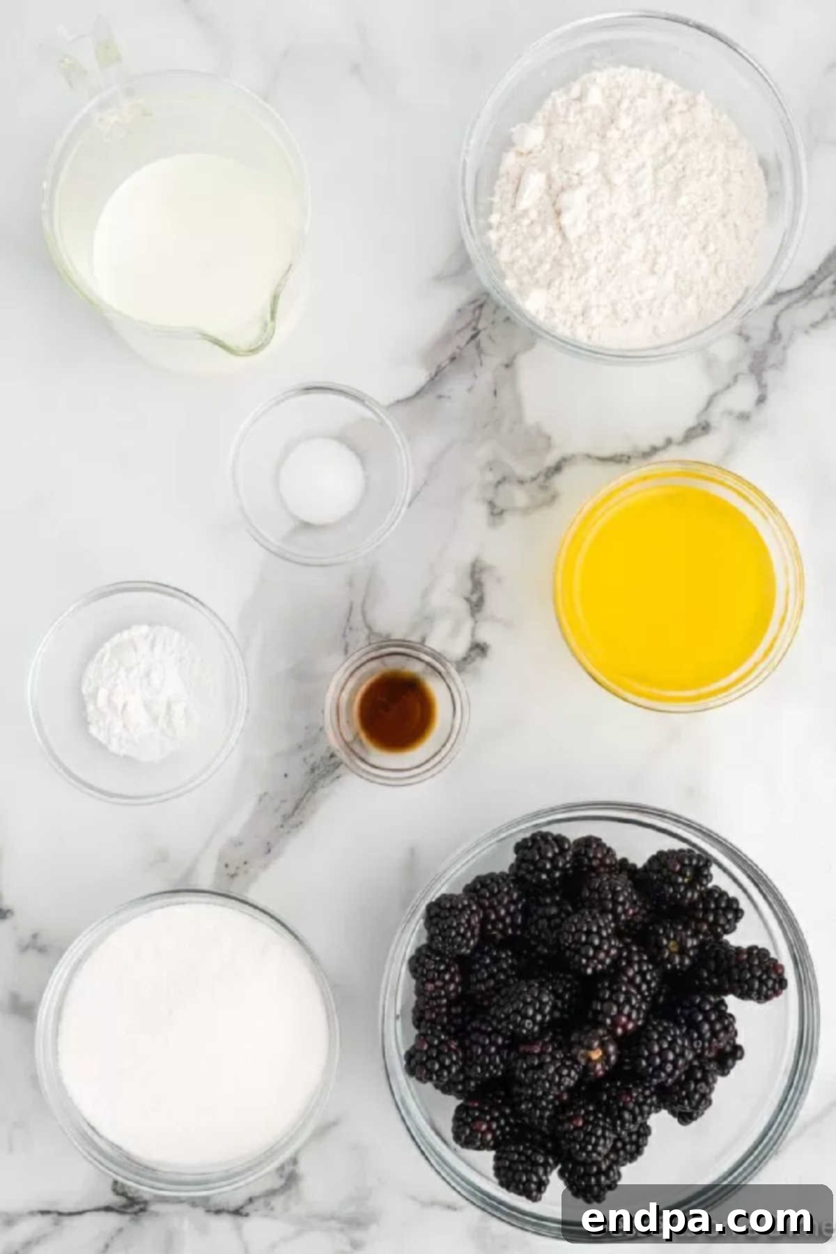 Ingredients for Blackberry cobbler - blackberries, flour, milk, vanilla, butter. 