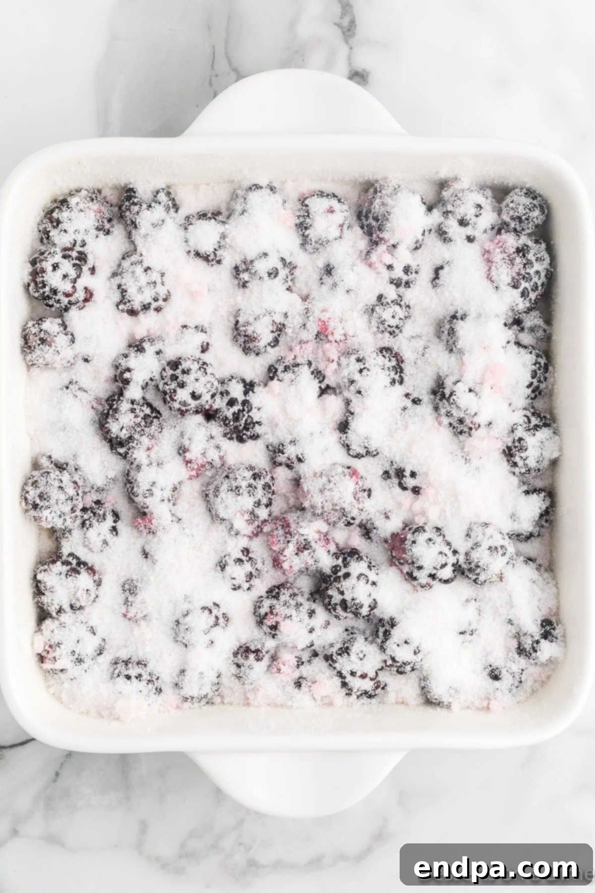 Blackberries topped on batter. 