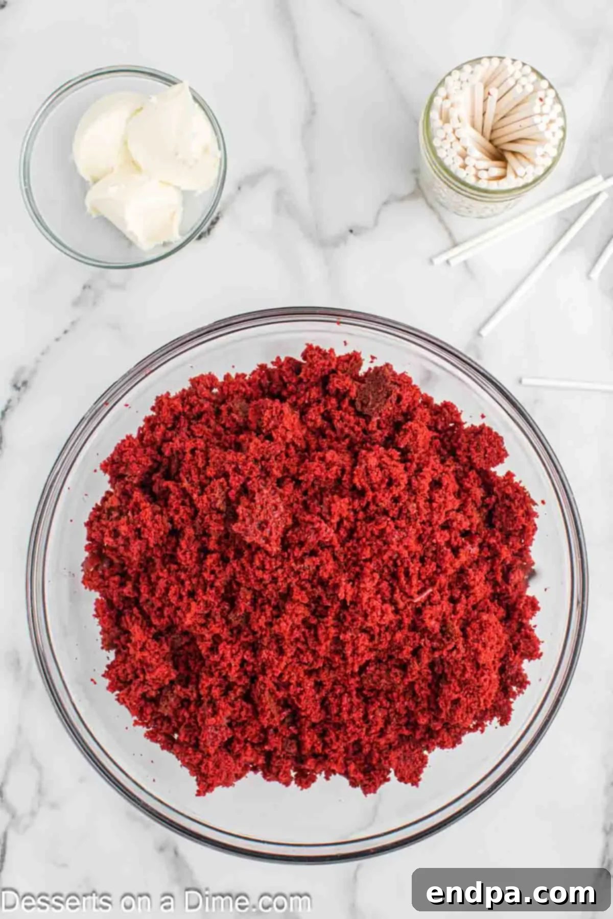 Grinchmas Cake Pops 5 Crumbled red velvet cake in a large mixing bowl, ready for frosting.