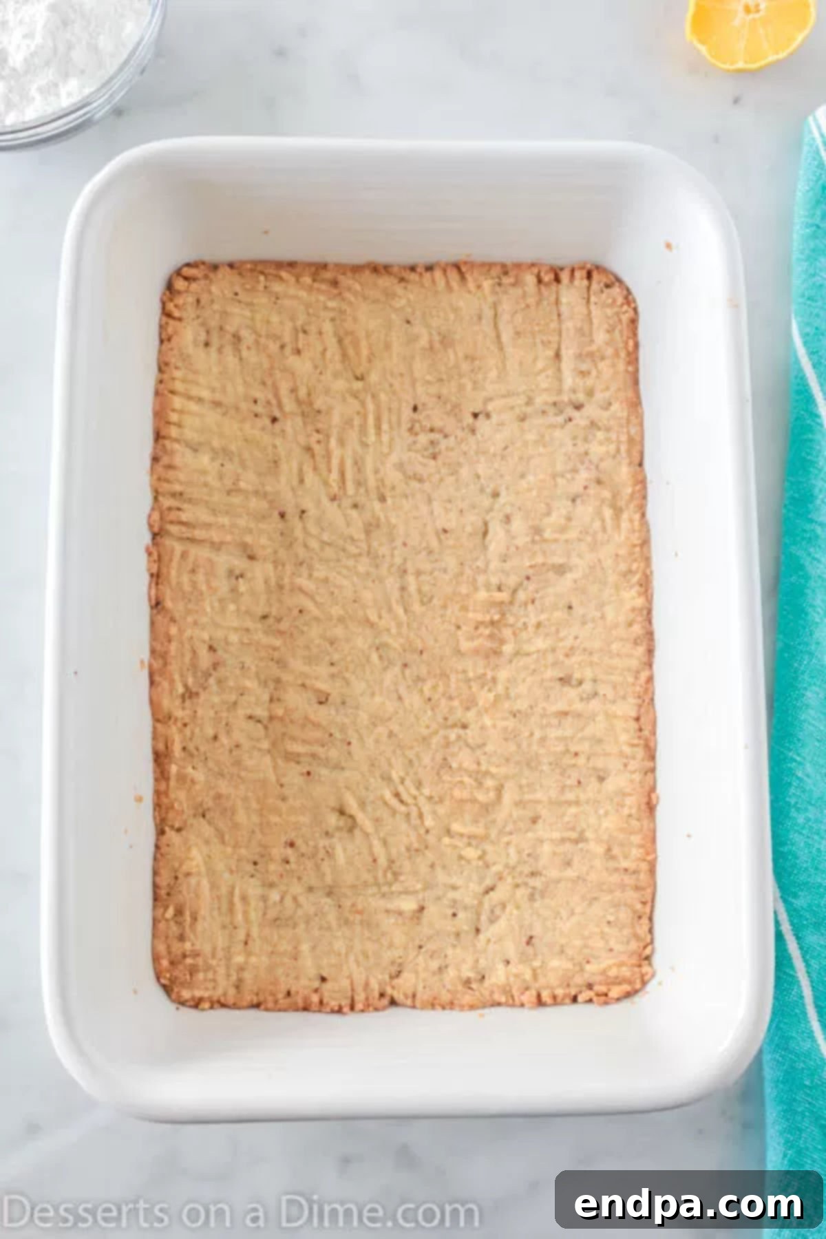 Pecan crust pressed into a baking dish, ready for baking.