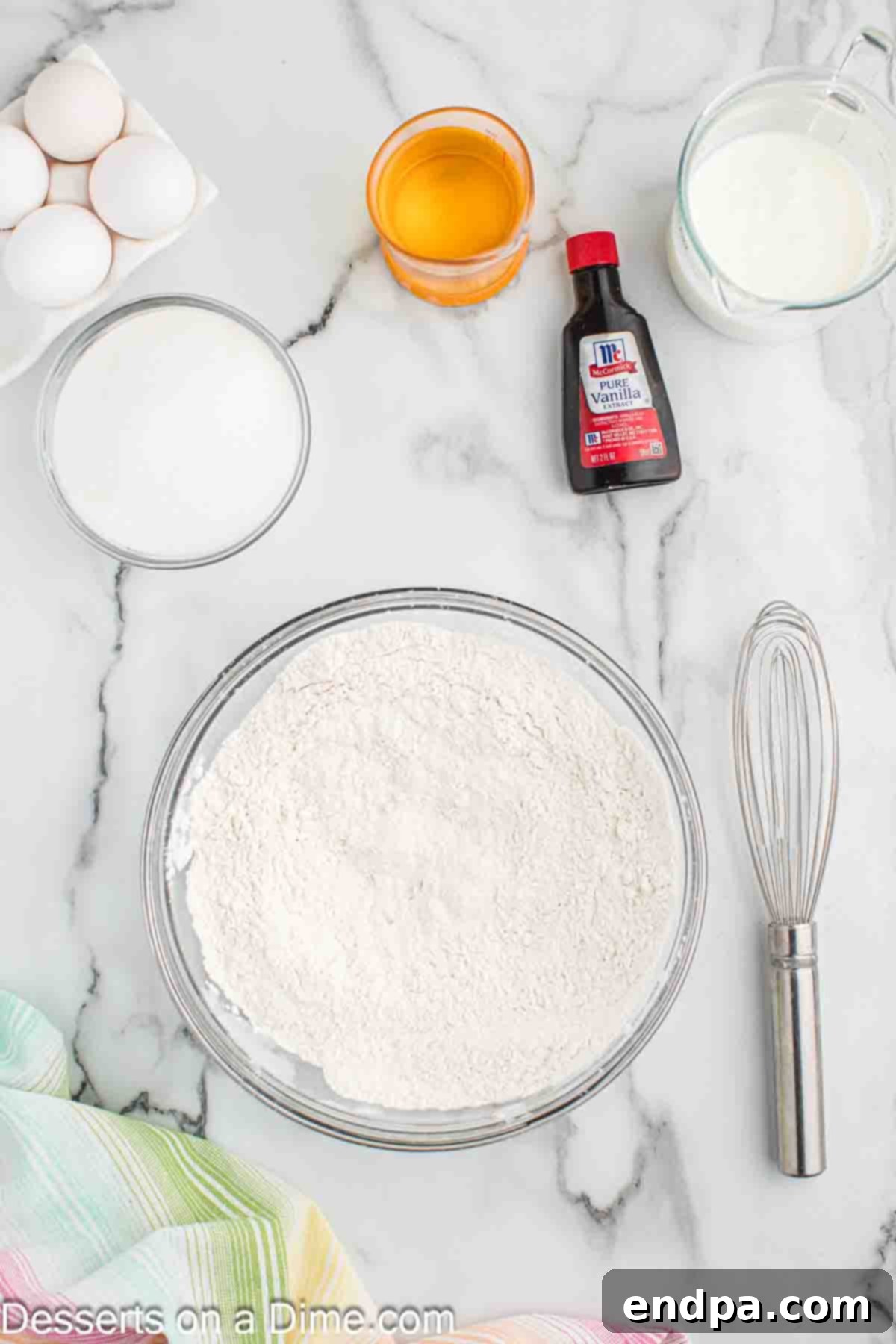 Dry ingredients for cupcakes being whisked in a bowl.