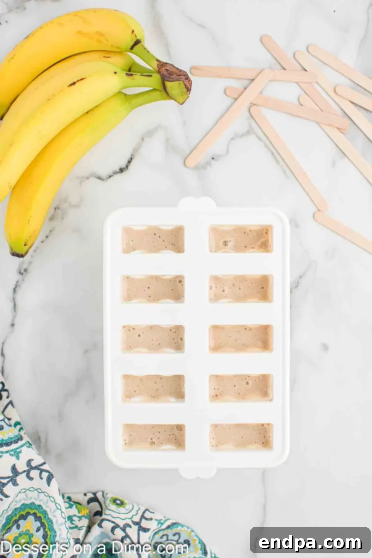 Frozen Banana Delights 5 Ingredients in popsicle mold ready to freeze.