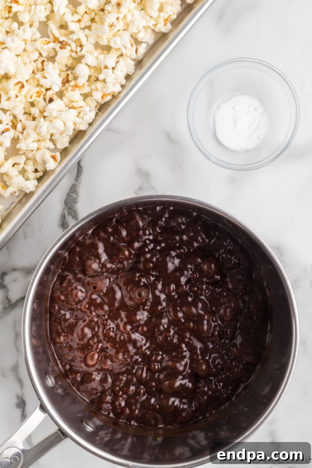 Decadent Chocolate Popcorn 4 Cocoa mixture in saucepan boiling.