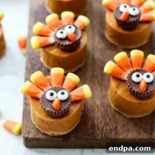 Candy pretzel turkey bites arranged on a platter, featuring chocolate and colorful candies.