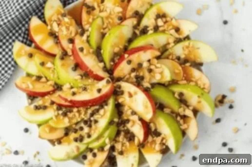 Caramel apple nachos with chocolate chips and nuts.