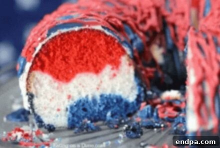 Red White and Blue Cake Masterpieces 3 A beautiful Red, White, and Blue Layered Cake with creamy frosting, ready to be served.