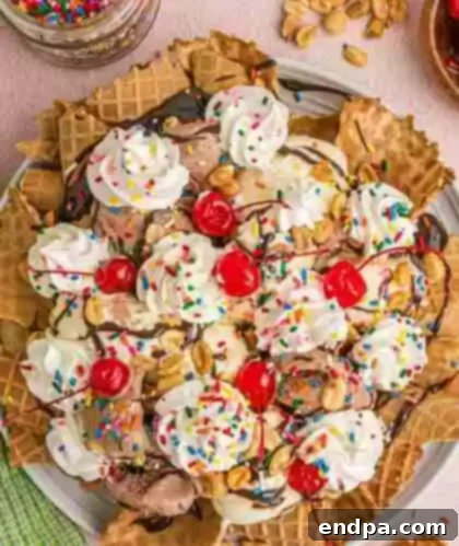 33 Scrumptious Ice Cream Treats 9 An ice cream sundae with whipped cream, cherries and sprinkles.