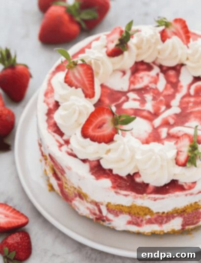 33 Scrumptious Ice Cream Treats 13 A strawberry cheesecake with whipped cream and strawberries.