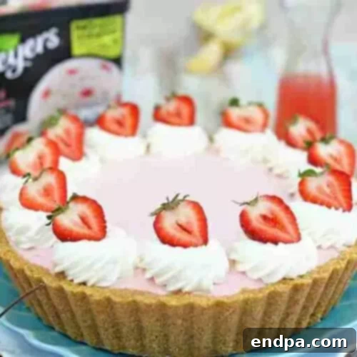 33 Scrumptious Ice Cream Treats 14 A strawberry cheesecake with whipped cream and strawberries.