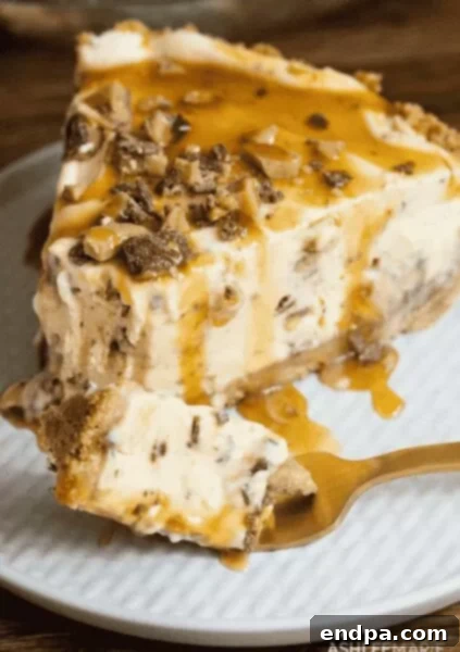 33 Scrumptious Ice Cream Treats 19 Slice of caramel turtle pie on a plate with a fork.