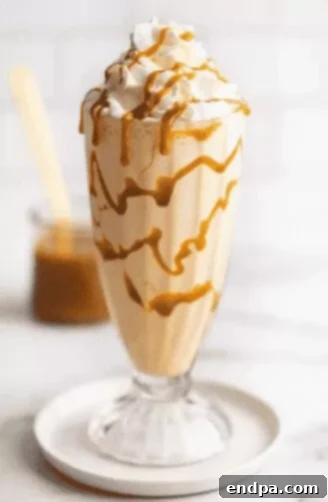 33 Scrumptious Ice Cream Treats 23 Caramel milkshake with whipped cream and caramel drizzle.