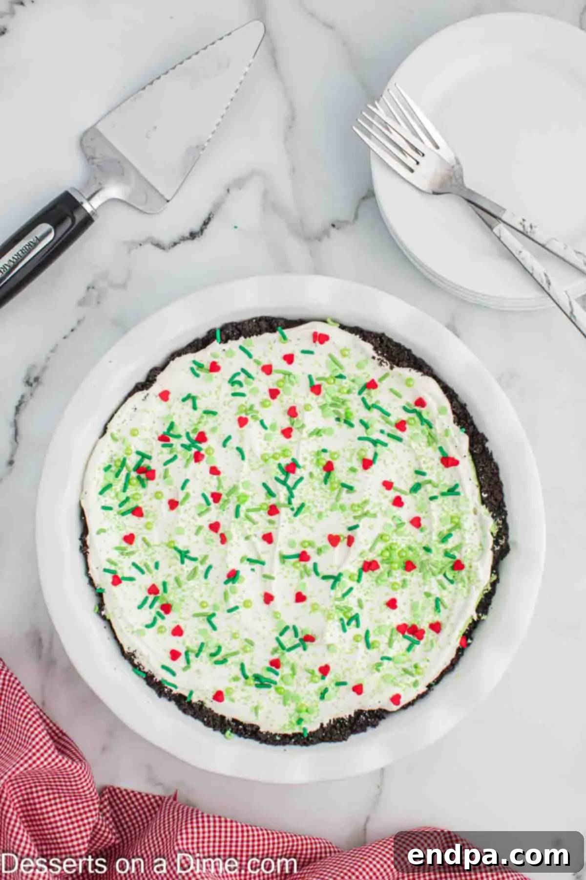 Prepared Grinch Pie in a pie plate, topped with sprinkles.
